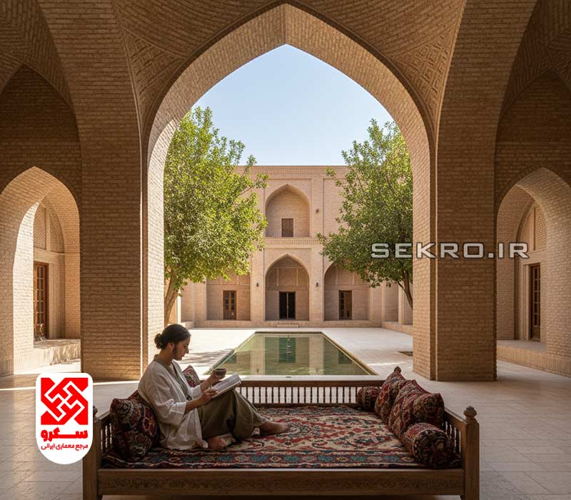 نمای عریض از ایوان خانه، شخصی آرام روی تخت نشسته و چای می‌نوشد، دور از هیاهوی شهر